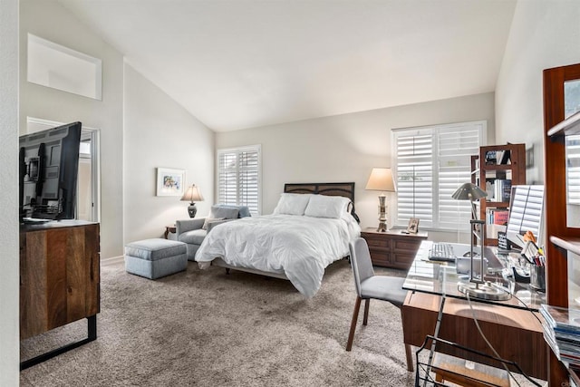 bedroom with light colored carpet and high vaulted ceiling