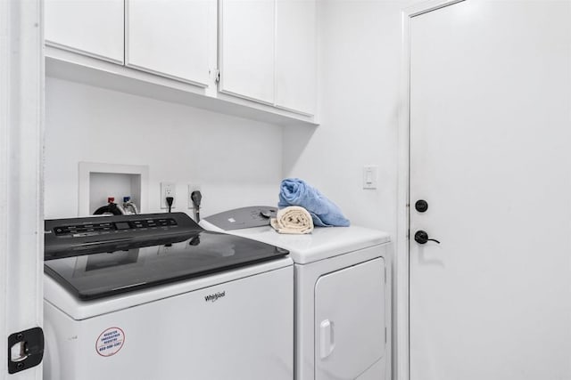 laundry area with cabinets and washer and dryer