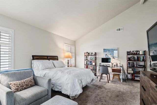 bedroom with vaulted ceiling and carpet