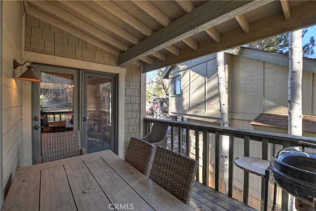 wooden terrace featuring a grill