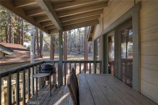 wooden deck featuring area for grilling