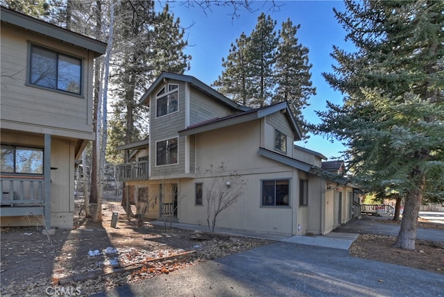 view of side of property featuring a balcony