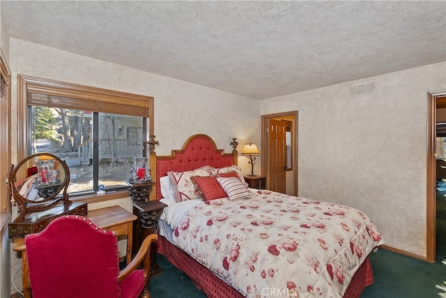 carpeted bedroom featuring a textured ceiling