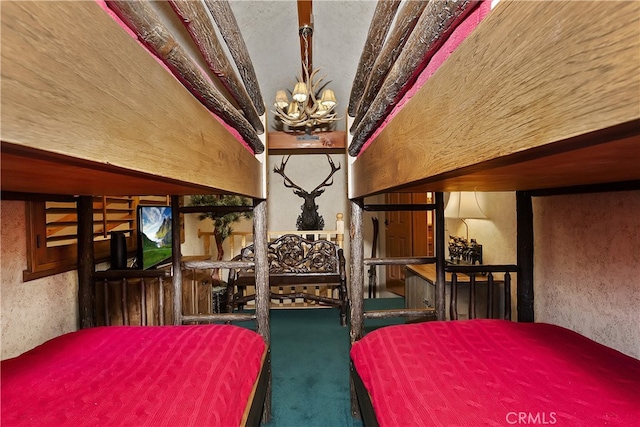 unfurnished bedroom featuring carpet floors and a notable chandelier