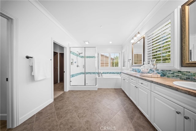 bathroom featuring ornamental molding, shower with separate bathtub, and a healthy amount of sunlight