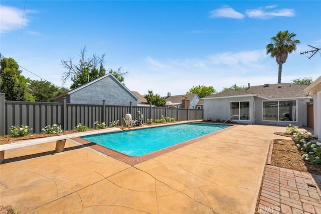 view of swimming pool with a patio