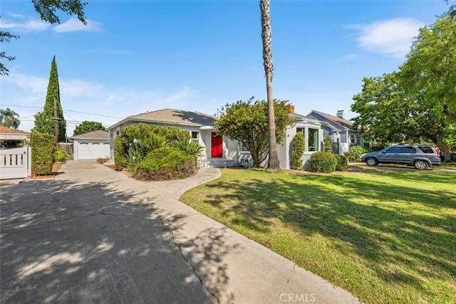 view of front facade featuring a garage and a front lawn