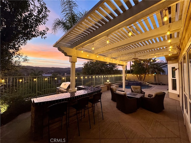 patio terrace at dusk with outdoor dry bar, an outdoor living space, and a pergola