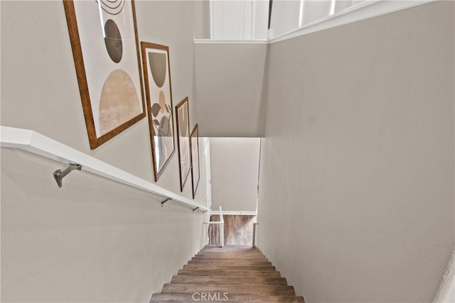 staircase featuring hardwood / wood-style flooring