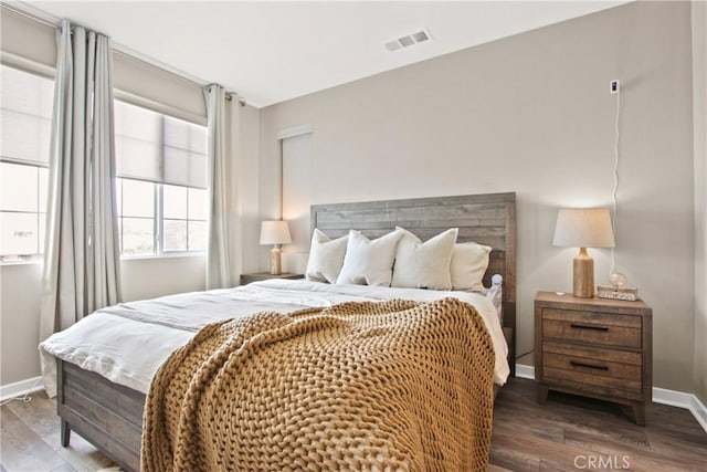 bedroom featuring dark hardwood / wood-style flooring