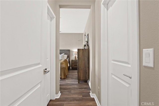 corridor featuring dark hardwood / wood-style floors