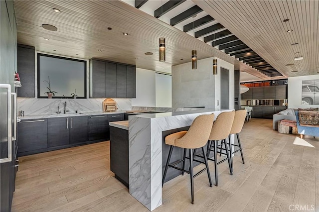 405 26th St, Manhattan Beach, CA 90266 - kitchen with wood ceiling, light wood-style flooring, a sink, a kitchen bar, and open floor plan