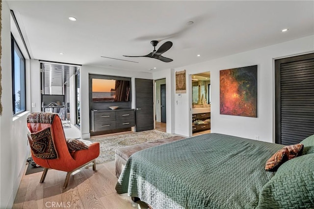 bedroom featuring light hardwood / wood-style flooring and ceiling fan