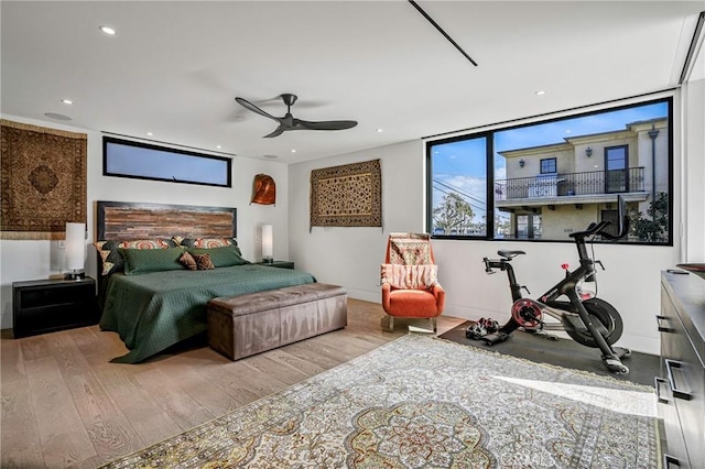 bedroom with ceiling fan and light wood-type flooring