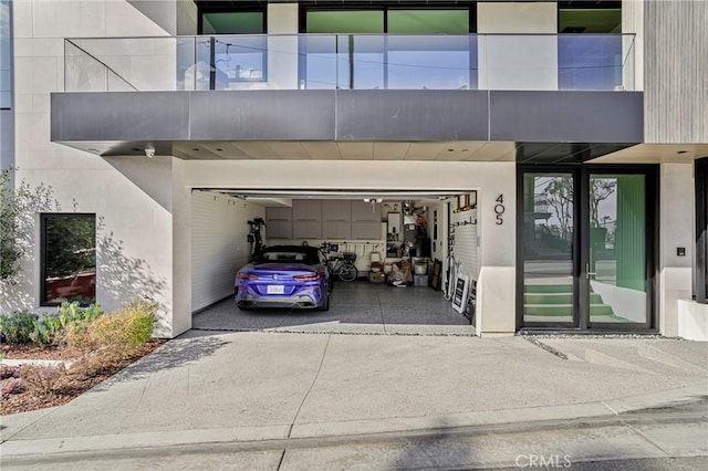 405 26th St, Manhattan Beach, CA 90266 - property entrance featuring an attached garage and driveway
