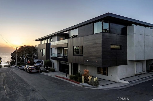 view of outdoor building at dusk