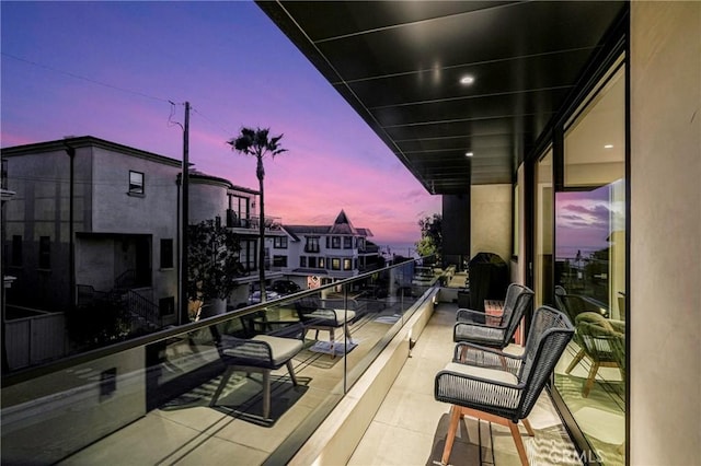 view of balcony at dusk