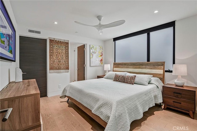 bedroom featuring ceiling fan and light hardwood / wood-style floors