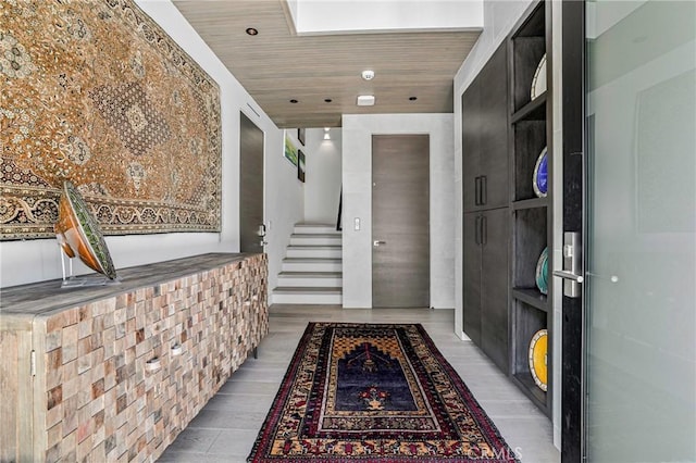 hall featuring wood ceiling and light hardwood / wood-style floors