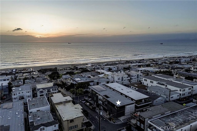 aerial view at dusk with a water view