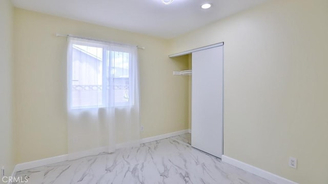 unfurnished bedroom with a closet