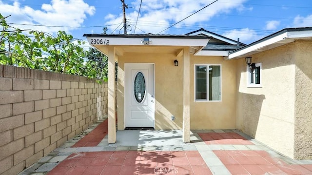 doorway to property with a patio area