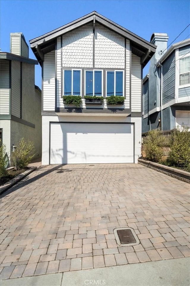 view of front of property with a garage