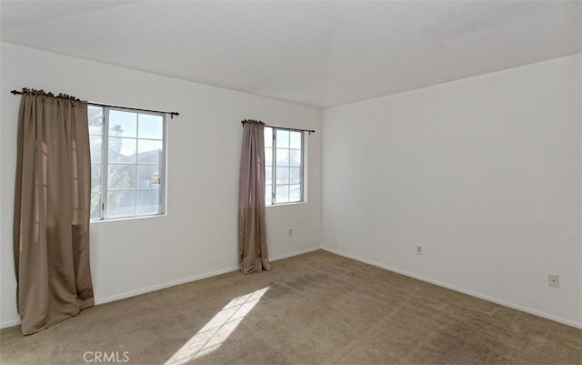 spare room with light colored carpet