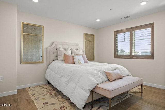 bedroom featuring wood-type flooring