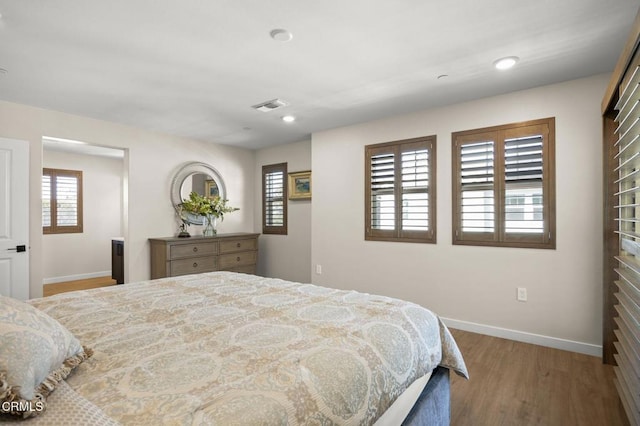 bedroom featuring hardwood / wood-style floors