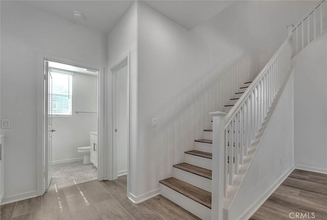 stairway with wood-type flooring