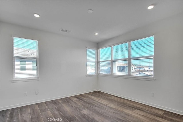 empty room featuring hardwood / wood-style floors