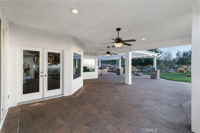 view of patio featuring french doors and a ceiling fan