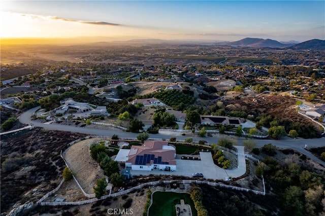 aerial view at dusk with a mountain view