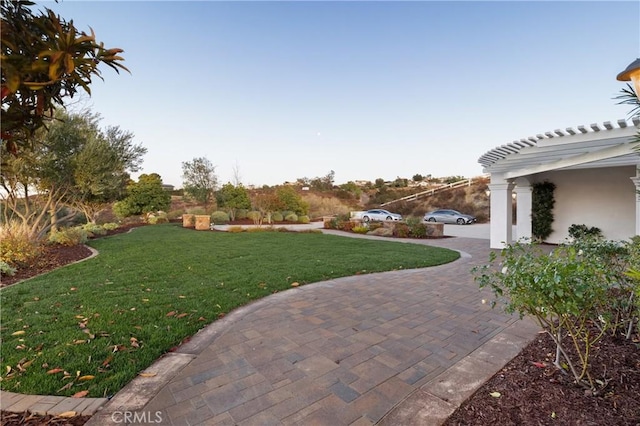 view of yard with a patio and a pergola