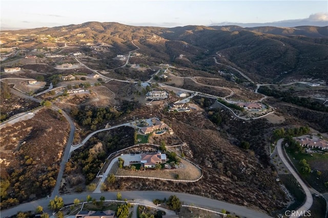 birds eye view of property with a mountain view