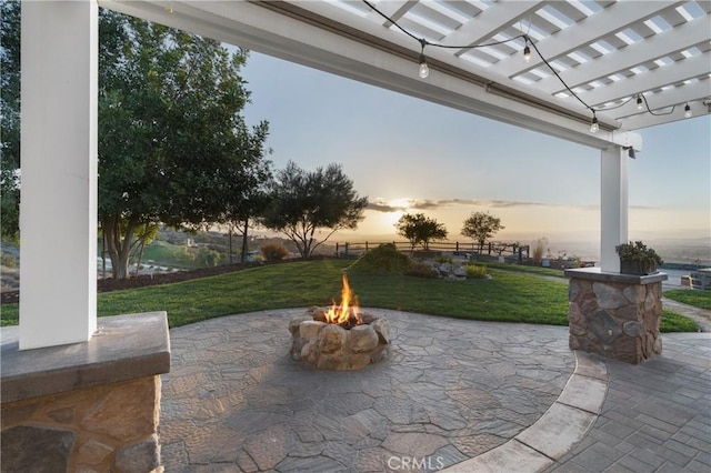 view of patio featuring a fire pit and a pergola