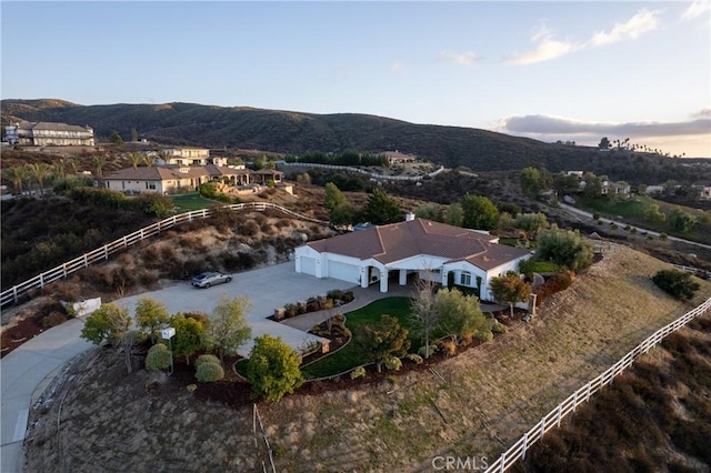 birds eye view of property with a mountain view