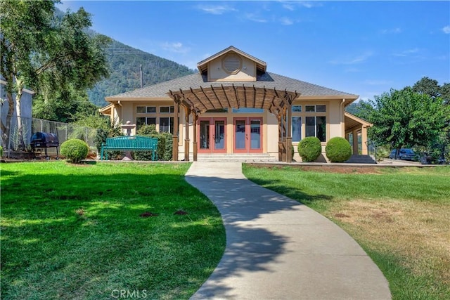 exterior space with fence and a mountain view