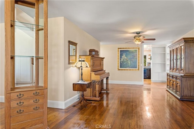 interior space featuring dark wood finished floors and baseboards