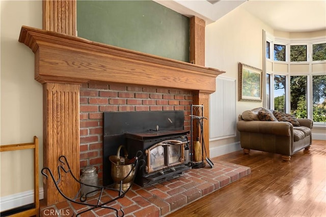 interior space featuring baseboards and wood finished floors