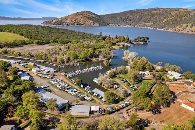 aerial view featuring a water and mountain view