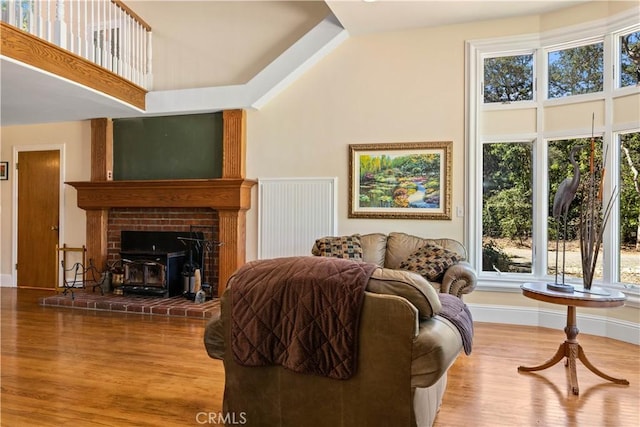 living room with baseboards and wood finished floors