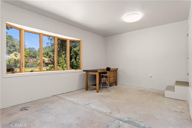 office space with concrete flooring