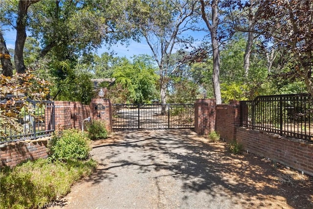 view of gate featuring fence