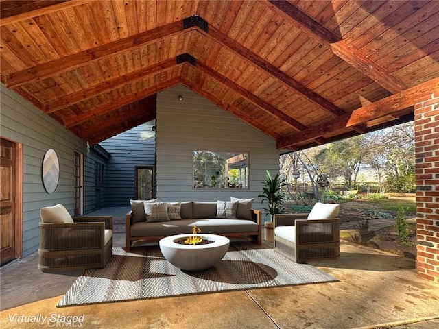 view of patio featuring an outdoor living space with a fire pit