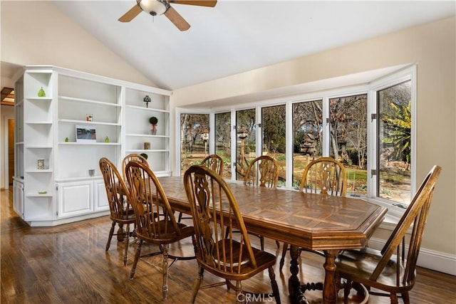 dining room with vaulted ceiling, ceiling fan, dark wood finished floors, and baseboards