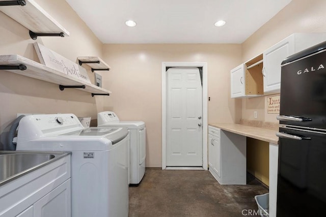 laundry area with cabinets and washer and dryer