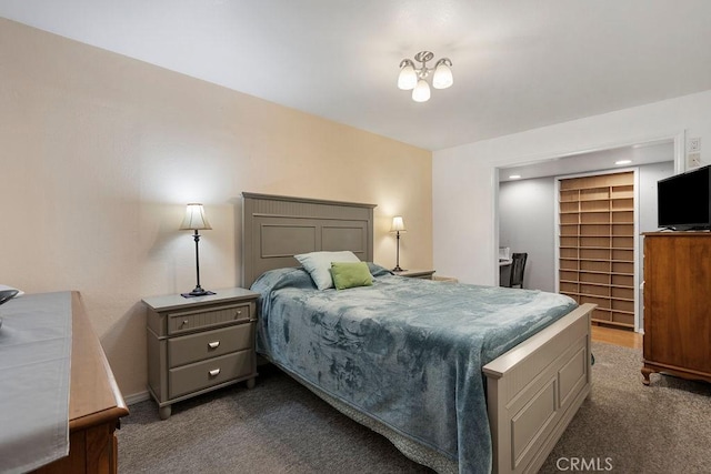 carpeted bedroom featuring a spacious closet