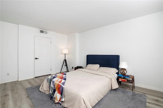 bedroom with light wood-type flooring